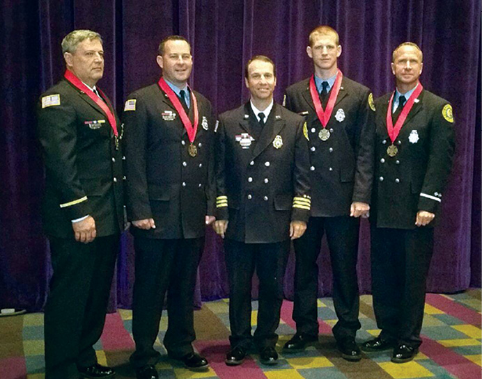 The crew of Engine 17 immediately after receiving the 2015 IAFC/Motorola Solutions Ben Franklin Award for Valor. (Photo courtesy of Chief Michael J. Barakey.).