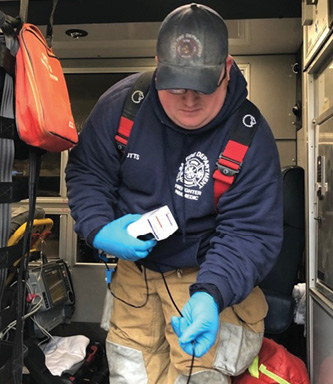 Tulsa (OK) Fire Department (TFD) Firefighter/Paramedic T.J. Potts prepares to administer Cyanokit after a victim was rescued from a structure fire. (Photos courtesy of author.)