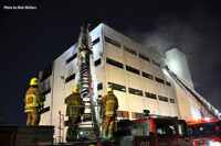 Firefighters on scene at the fire in a vacant building in Los Angeles.