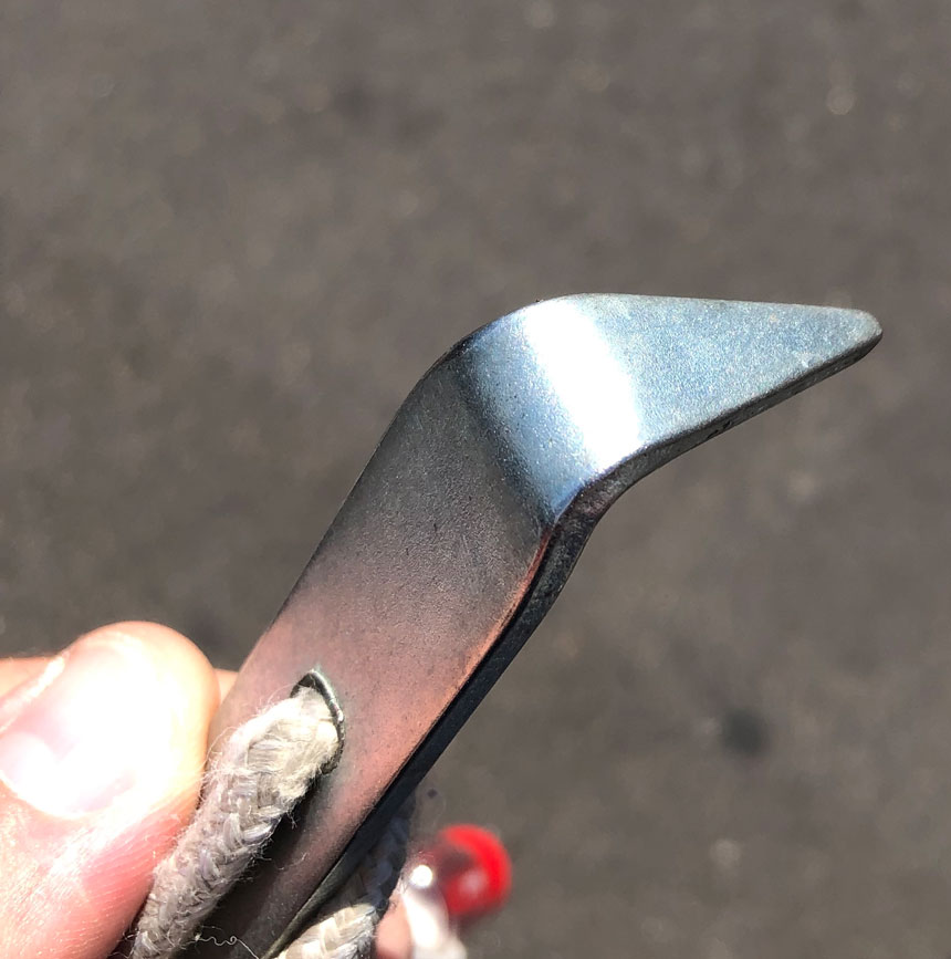 Angled end of key tool