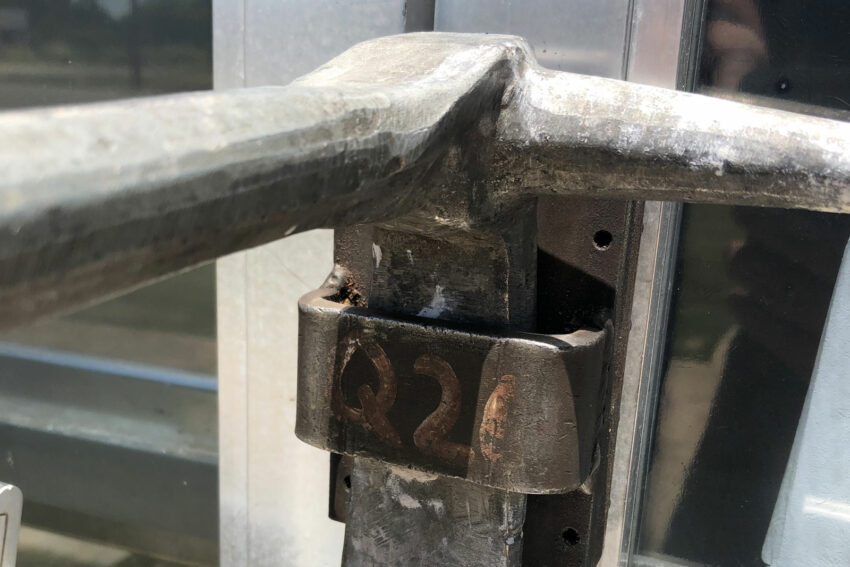 Halligan and tool being used for through-the-lock forcible entry