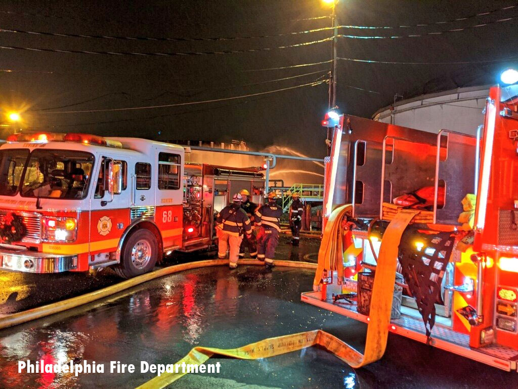 Philadelphia Fire Department rigs at fuel facility fire