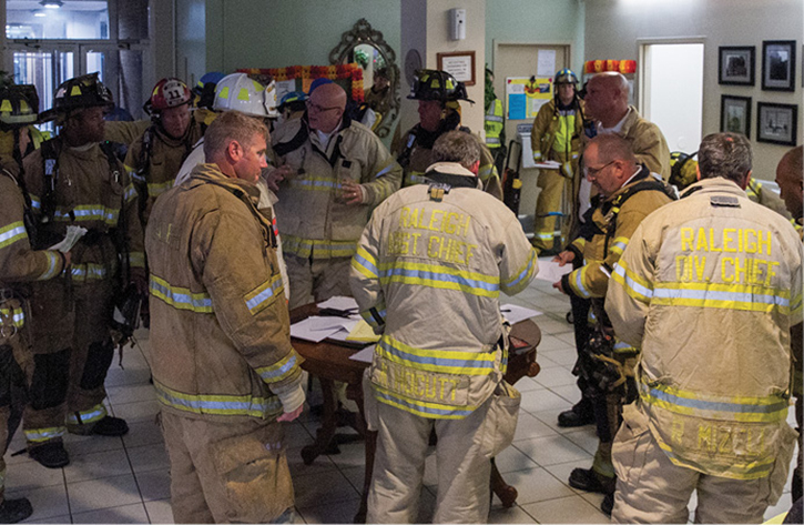 The command post was in the lobby. The postincident review recommended, when possible, placing the command post in a remote area. In the lobby, all the incident management personnel were in the path of incoming personnel and evacuating residents.