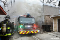 A Chicago fire truck enshrouded in smoke.