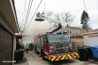 Chicago firefighters in a bucket at the fire scene