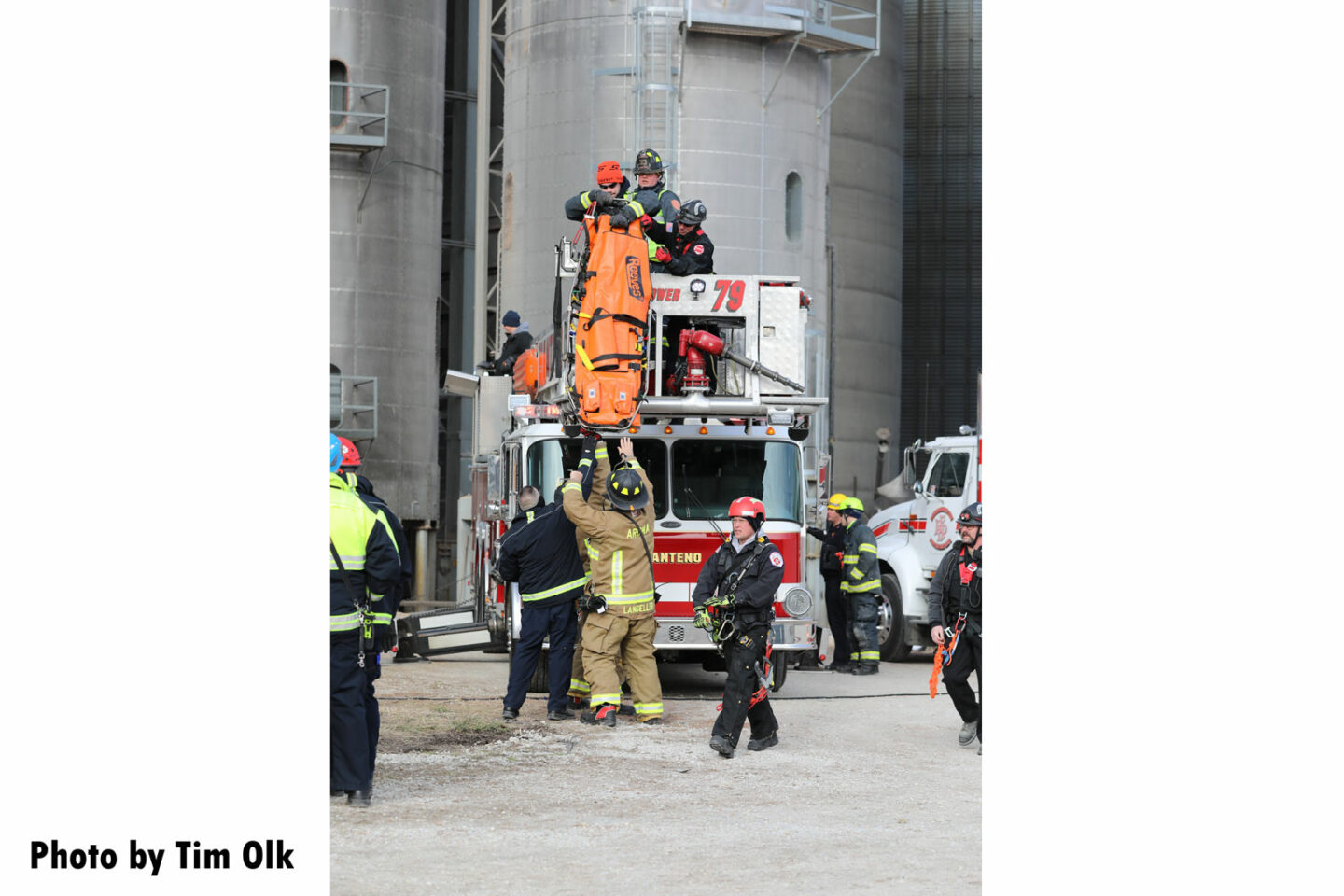 Firefighters respond to the scene of a rescue and recovery operation at a grain bin near Manteno, Illinois.