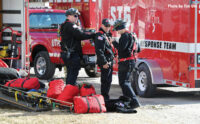 Firefighters gear up for the grain bin operation