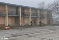 Firefighters at the scene of a fire at a former motel