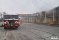 Tower ladder bucket extended to balcony of motel