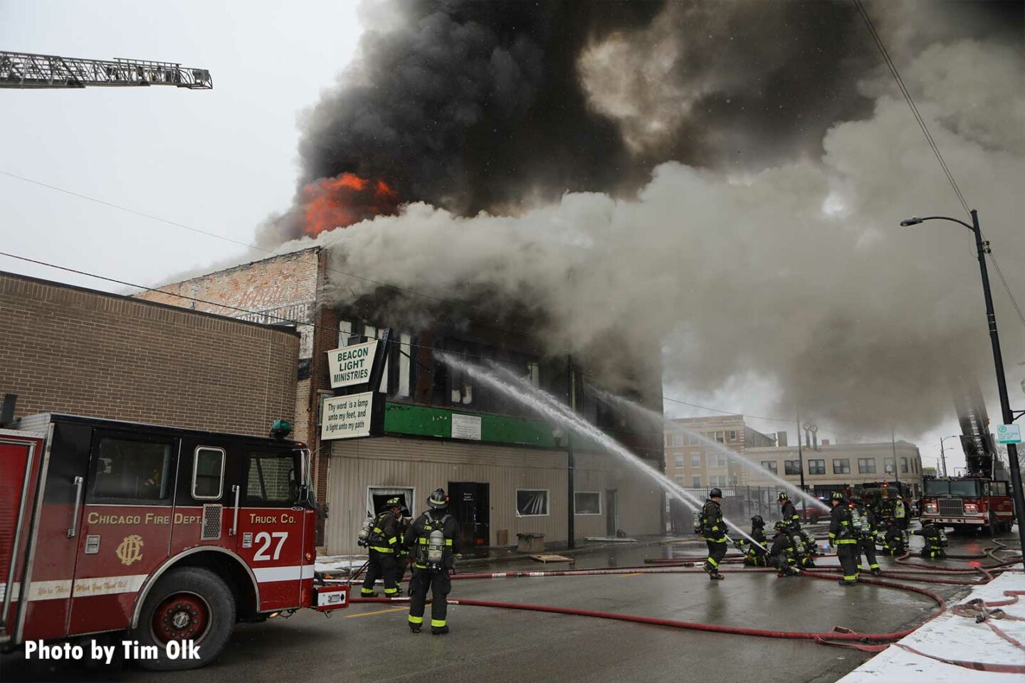 Smoke and flames visible from the structure