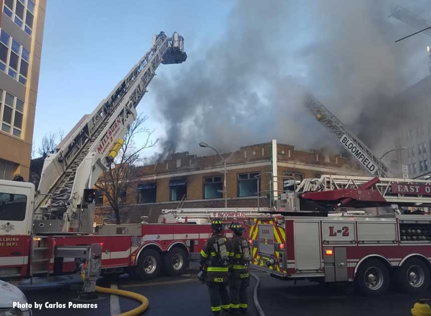 An array of apparatus at a fire in a building housing several business in Bloomfield, New Jersey.