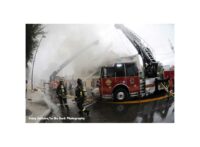 Smoke hangs over the scene as Orlando firefighters work