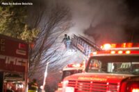 Aerial device over house fire