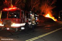 City of Los Angeles fire truck with fire on side of the road