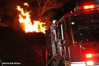 Fire apparatus with fire blazing behind it