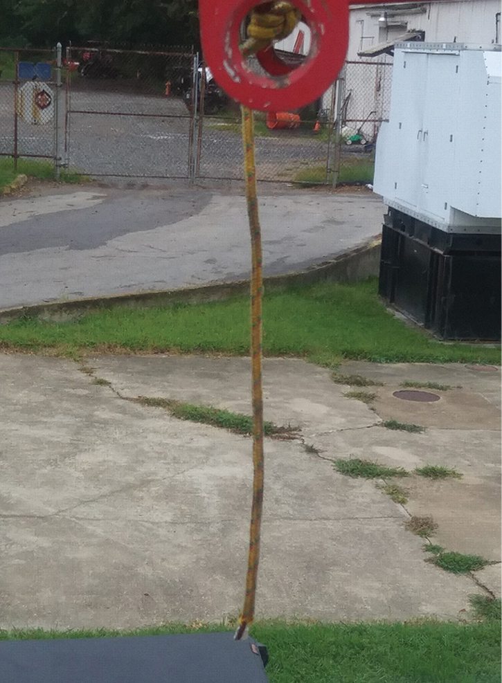 Use a rope (reflective/light colored) to use as a depth gauge when spotting rooflines.