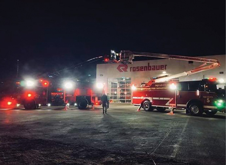 Even when equipped with lights, a black or dark colored aerial device has no contrast against the night sky. [Photos courtesy of the Wyndmoor (PA) Hose Company.]