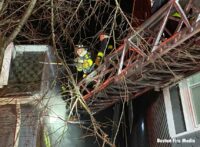 Boston firefighters on an aerial