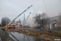 A view of aerial apparatus at the scene of the fire