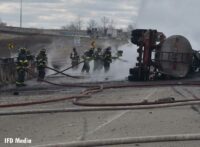 Fire crews use hoselines at the scene of the tanker fire