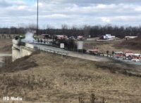 Fire trucks and firefighters at the scene of the tanker truck fire