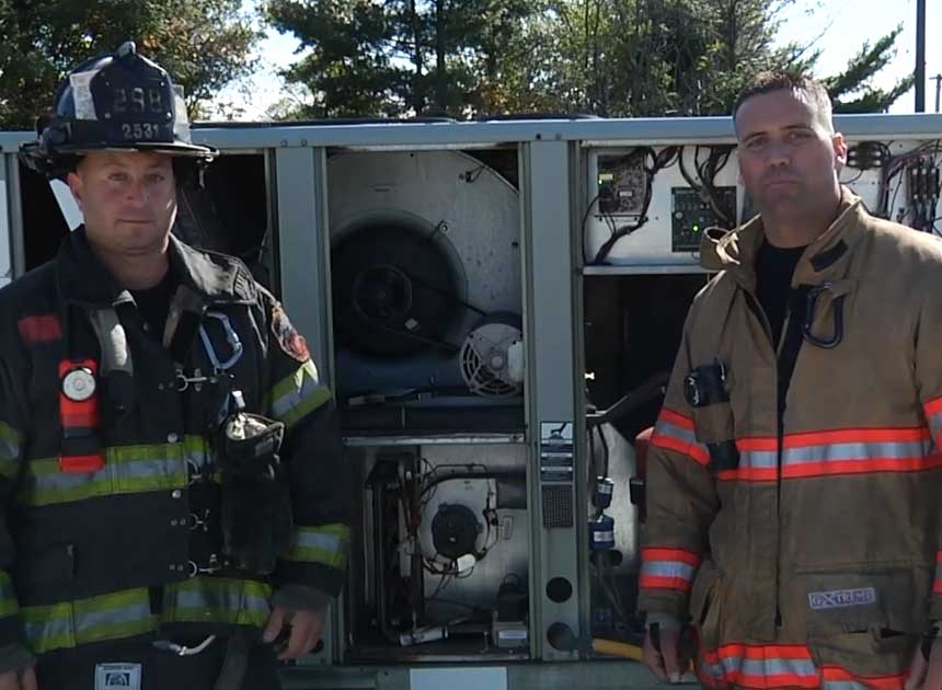 Anthony Deko and Adam Hansen on HVAC rooftop units