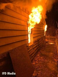 Flames shoot from a window during the fire