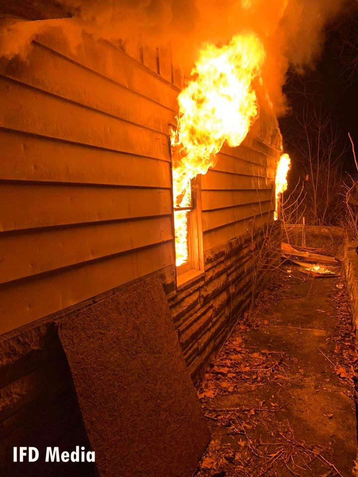 Flames shoot from a window during the fire