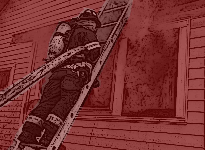 Firefighter with a hose on a ladder