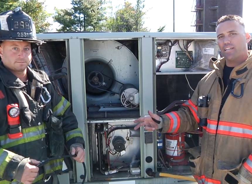 Anthony Deko and Adam Hansen on HVAC rooftop units