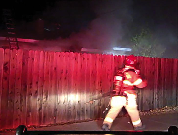 Limited view from the ICP of a house fire at night. (Photos courtesy of author.) 