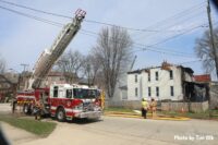 Fire truck with aerial ladder on the fireground