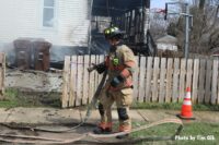 Firefighter with a hoseline at the fire scene