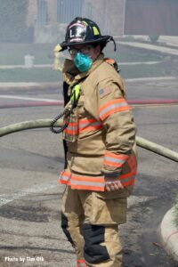 Firefighter wearing a mask in the time of the coronavirus pandemic