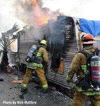 Firefighters at the scene of a trailer fire in Los Angeles