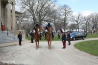 Firefighters mounted on horses at the funeral