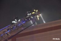 Firefighters on aerial ladder