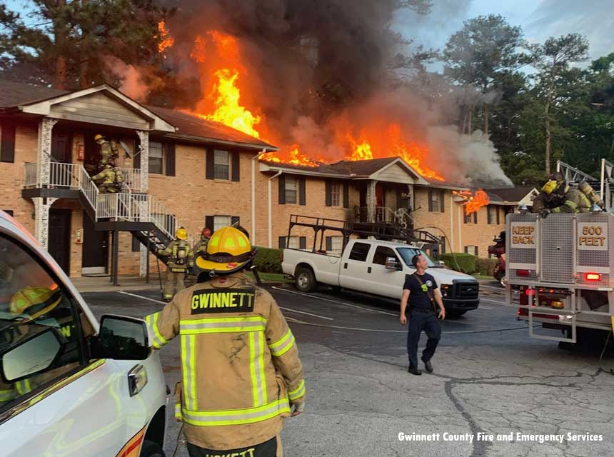 Flames blow out of an apartment fire in Gwinnett County, Georgia