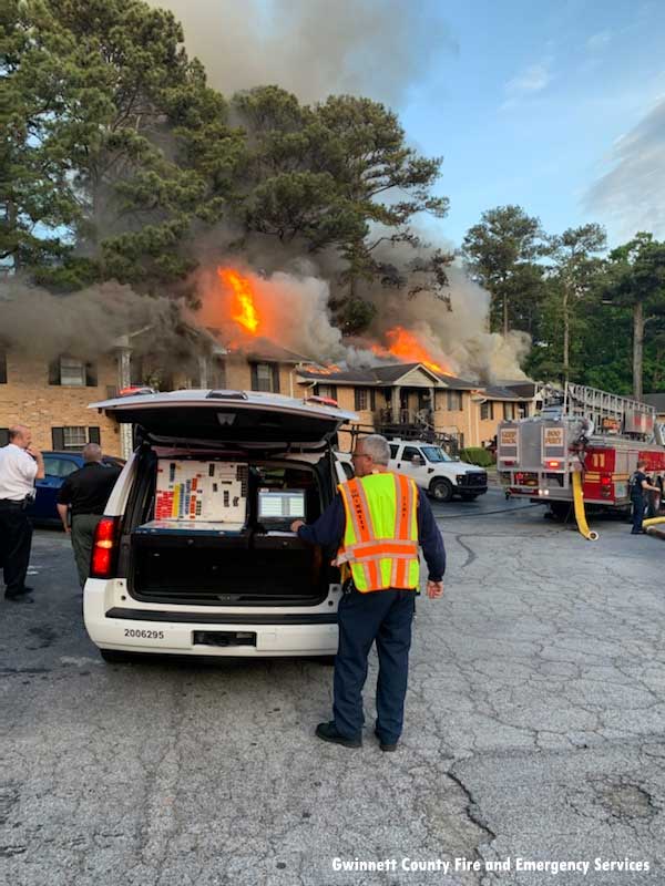 Gwinnett County firefighters at a major fire in an apartment complex