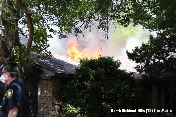 Fire vents from the roof during a Texas house fire