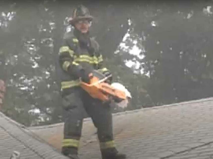 Mike Ciampo with rotary saw on a roof