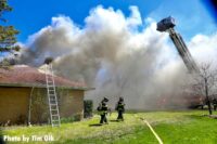 Ladders are raised and a tower ladder is seen