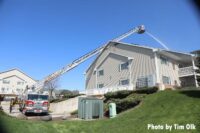 An aerial device in operation at an apartment fire