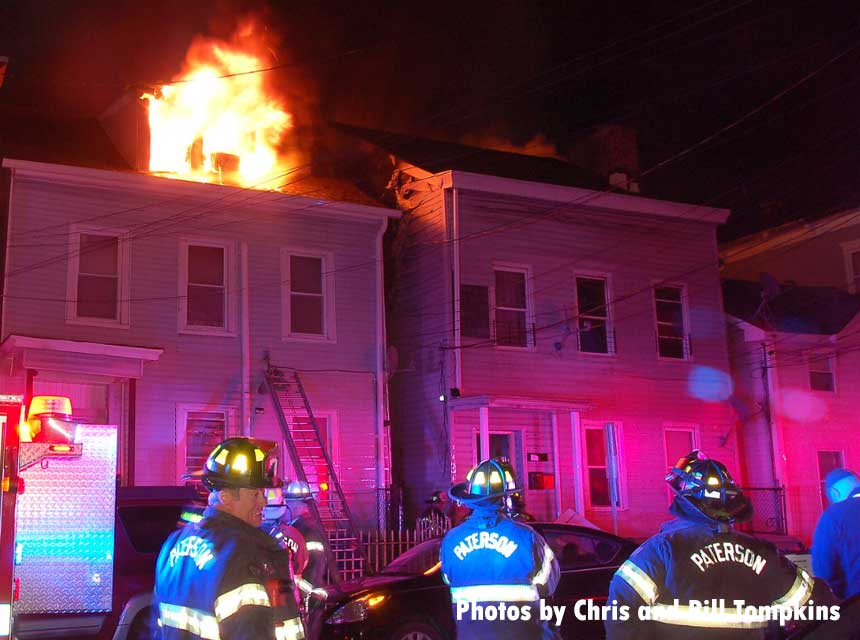 Paterson firefighters at the scene of a fire that went to seven alarms.