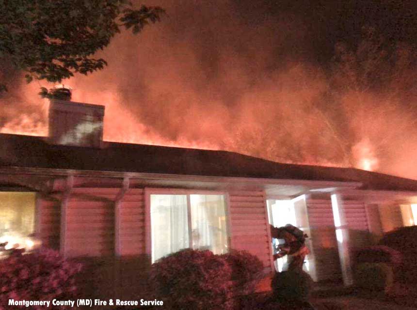 Firefighter makes entry during a duplex fire