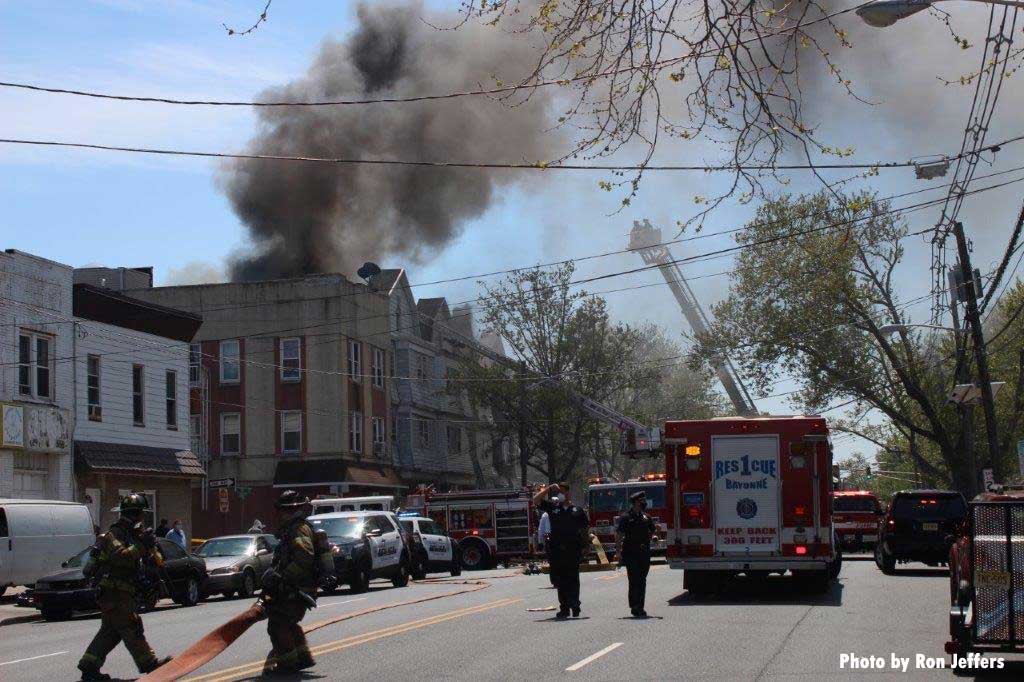 Firefighters and apparatus at a four-alarm Bayonne fire