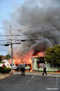 Massive flames and smoke rise from the building