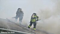 Fierfighters work on vertical ventilation