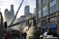 City of Los Angeles fire apparatus and firefighters at the scene of the explosion