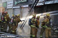 Firefighters put water on the fire in Los Angeles